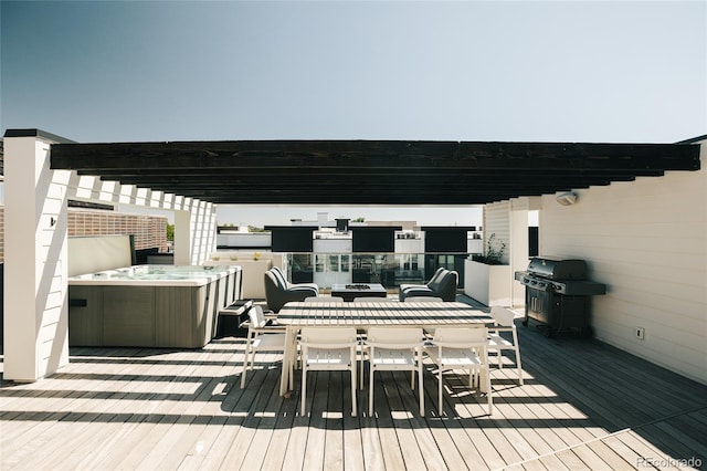 deck featuring a pergola, a hot tub, and a grill