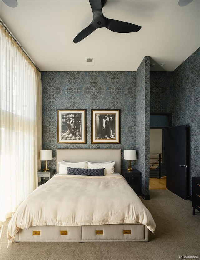 carpeted bedroom with ceiling fan