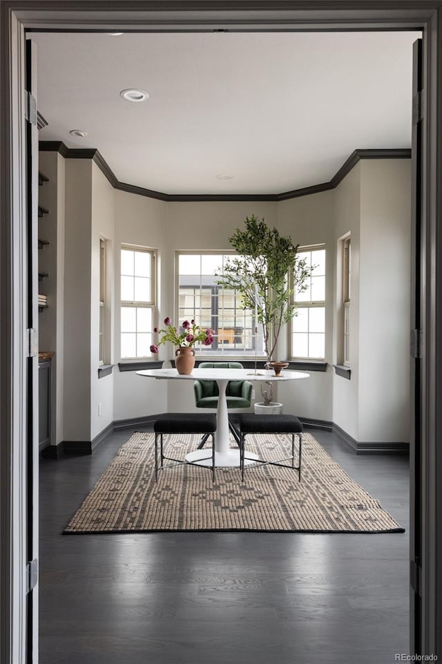 home office featuring ornamental molding, baseboards, and wood finished floors