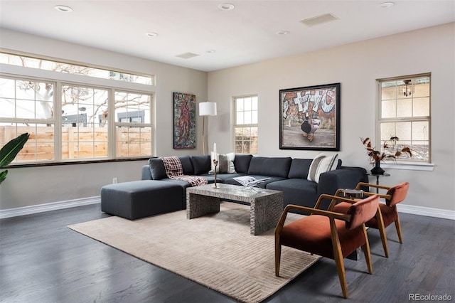 living room featuring dark wood finished floors, visible vents, recessed lighting, and baseboards