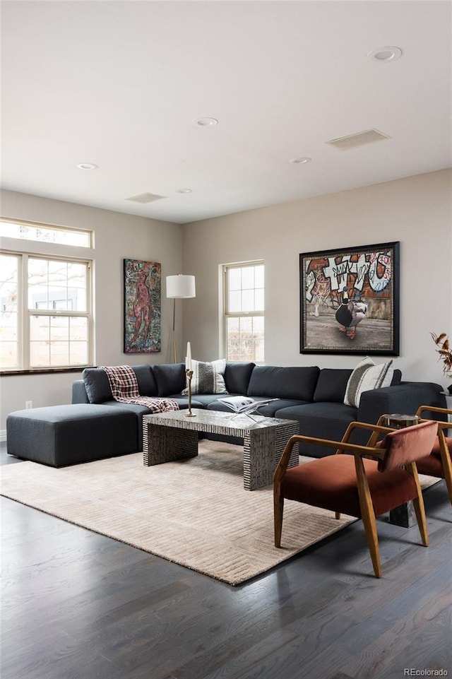 living room featuring recessed lighting and wood finished floors