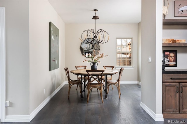 dining area with a notable chandelier, dark wood-type flooring, and baseboards