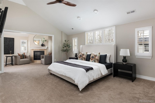 bedroom with visible vents, a fireplace, baseboards, and carpet