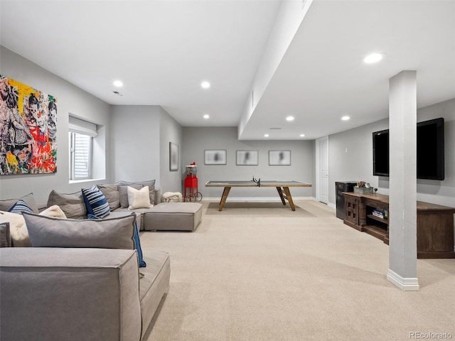 carpeted living area featuring recessed lighting and baseboards