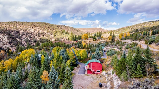 983 Beard Creek Rd, Edwards, CO 81632 - aerial view of property and surrounding area with a mountain backdrop and a forest