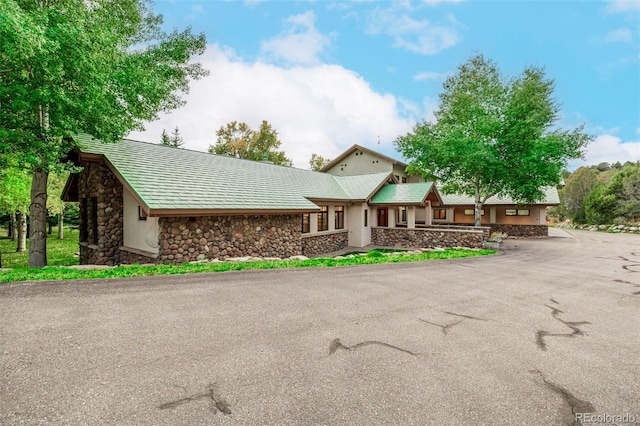 983 Beard Creek Rd, Edwards, CO 81632 - view of front of house featuring stone siding, driveway, and stucco siding