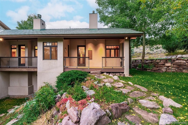 983 Beard Creek Rd, Edwards, CO 81632 - rear view of property with stucco siding, a porch, and a chimney