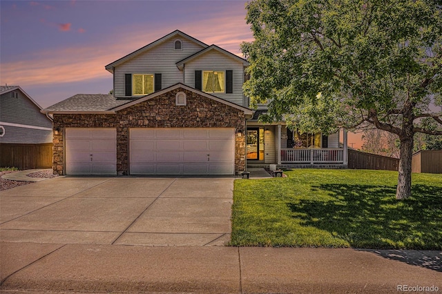 1325 Kingsfield St, Castle Rock, CO 80104 - traditional-style house with stone siding, concrete driveway, a garage, and covered porch