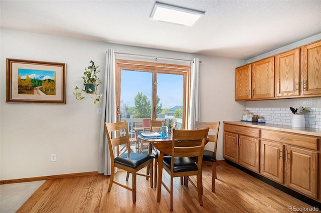 1325 Kingsfield St, Castle Rock, CO 80104 - dining space featuring light wood-type flooring and baseboards