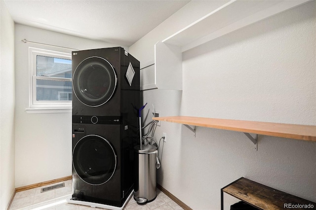 1325 Kingsfield St, Castle Rock, CO 80104 - laundry room with stacked washer / drying machine and baseboards