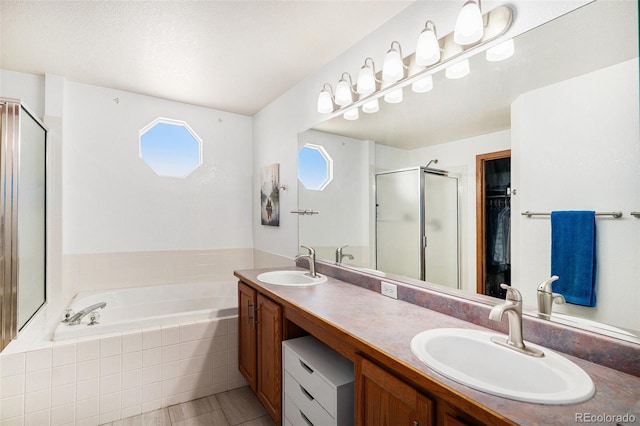 1325 Kingsfield St, Castle Rock, CO 80104 - full bathroom featuring a stall shower, a bath, double vanity, and a spacious closet