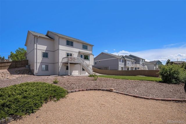 1325 Kingsfield St, Castle Rock, CO 80104 - back of house with stairs and a deck