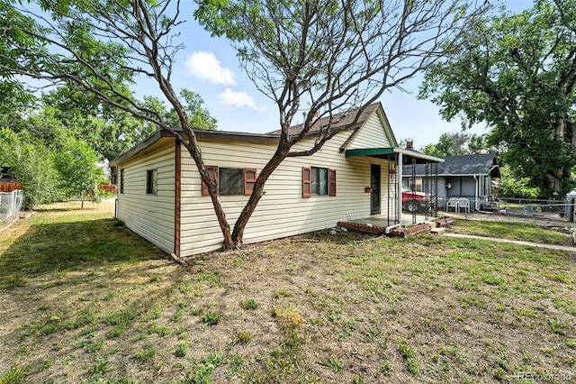 12 Marshall Pl, Longmont, CO 80504 - view of side of home with a patio and a fenced backyard