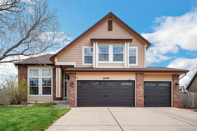 traditional-style house with roof with shingles, driveway, a garage, and brick siding