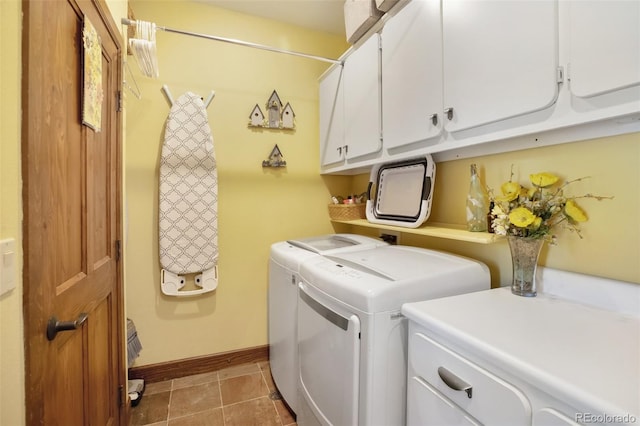 221 Columbine Pl, Woodland Park, CO 80863 - washroom with washing machine and dryer, cabinet space, and light tile patterned floors