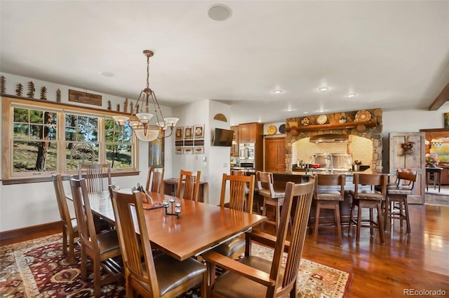 221 Columbine Pl, Woodland Park, CO 80863 - dining space featuring dark wood-type flooring, a chandelier, and recessed lighting
