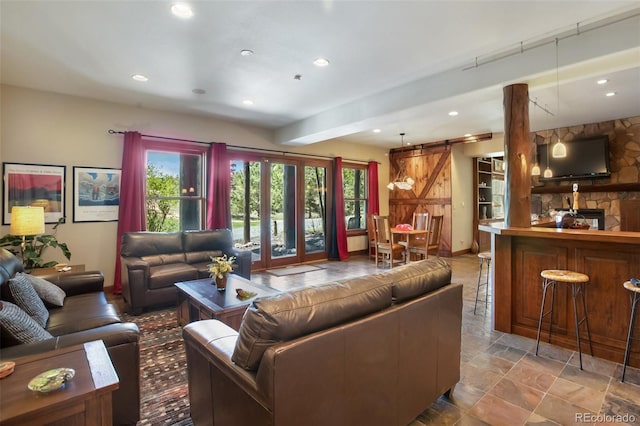 221 Columbine Pl, Woodland Park, CO 80863 - living area with a barn door, recessed lighting, and beamed ceiling