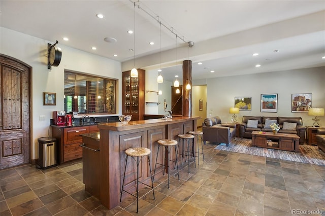221 Columbine Pl, Woodland Park, CO 80863 - indoor wet bar with recessed lighting and hanging light fixtures