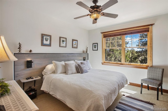 221 Columbine Pl, Woodland Park, CO 80863 - carpeted bedroom with baseboards and ceiling fan