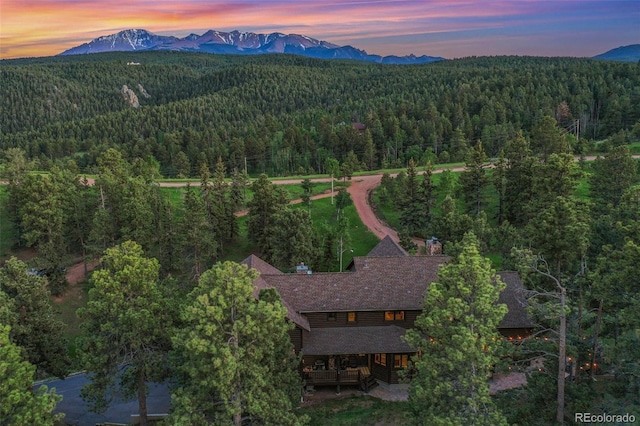 221 Columbine Pl, Woodland Park, CO 80863 - aerial view at dusk of a view of trees and a mountain view