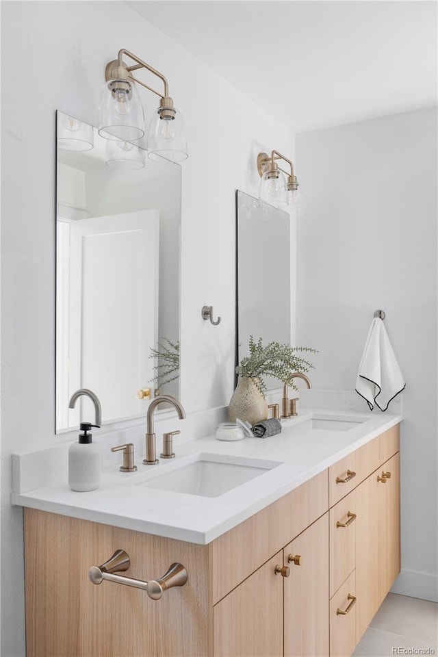 full bathroom featuring a sink and double vanity