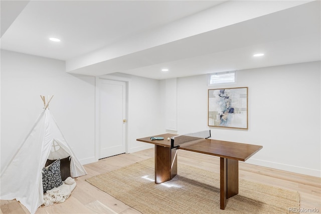 recreation room featuring baseboards, light wood-type flooring, and recessed lighting