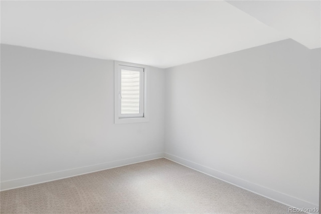 empty room featuring baseboards