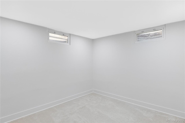 basement with carpet floors and baseboards