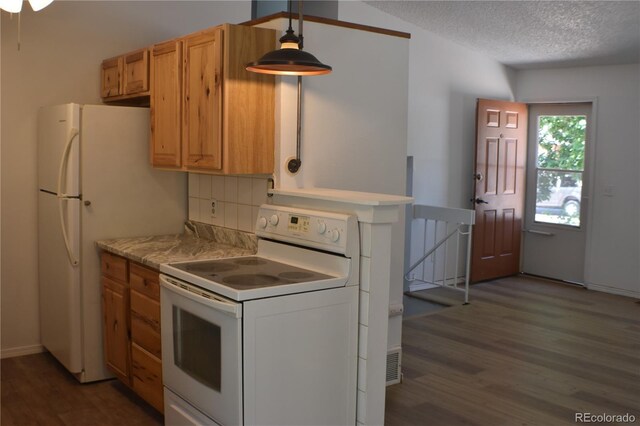 4585 Gatewood Dr, Colorado Springs, CO 80916 - kitchen featuring white appliances, wood finished floors, backsplash, a textured ceiling, and light countertops