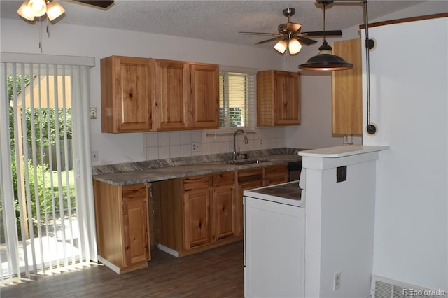 4585 Gatewood Dr, Colorado Springs, CO 80916 - kitchen featuring a ceiling fan, range with electric stovetop, decorative backsplash, dark wood-style floors, and a textured ceiling