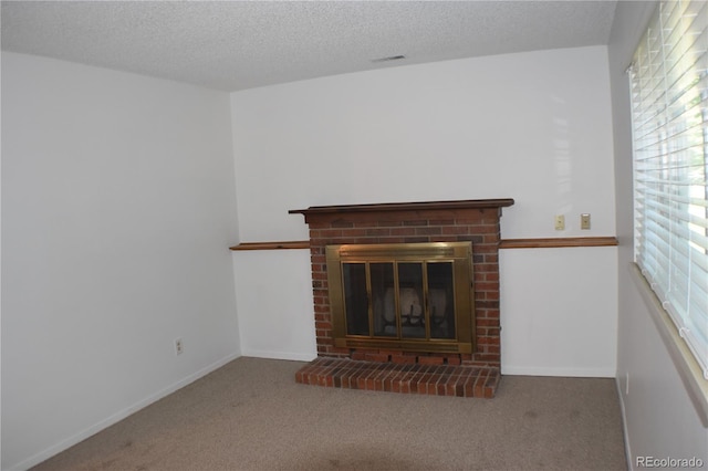 4585 Gatewood Dr, Colorado Springs, CO 80916 - unfurnished living room with a fireplace, carpet flooring, and a textured ceiling