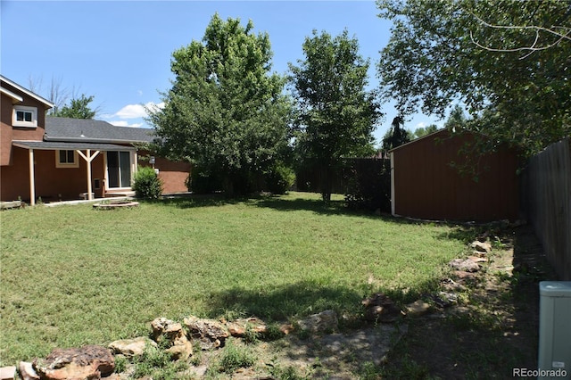 4585 Gatewood Dr, Colorado Springs, CO 80916 - fenced backyard featuring a storage unit