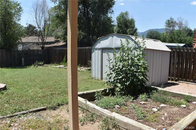 4585 Gatewood Dr, Colorado Springs, CO 80916 - fenced backyard featuring a storage shed and a mountain view