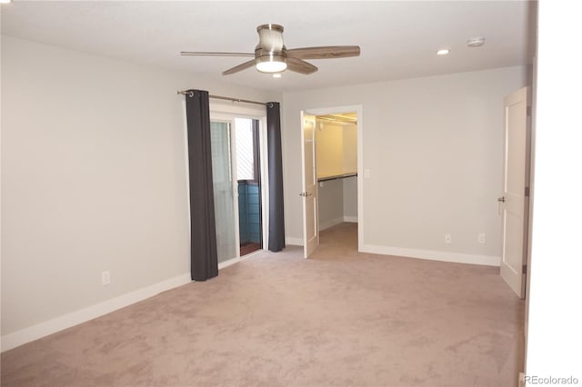 12033 E Harvard Ave Unit 208, Aurora, CO 80014 - unfurnished bedroom with light colored carpet, recessed lighting, a walk in closet, and a ceiling fan