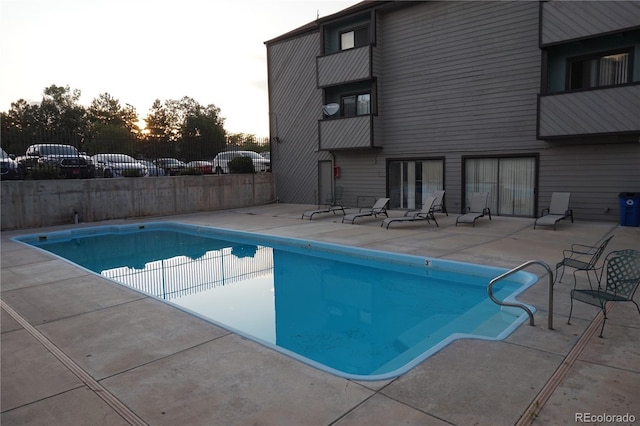 12033 E Harvard Ave Unit 208, Aurora, CO 80014 - pool at dusk with a patio area