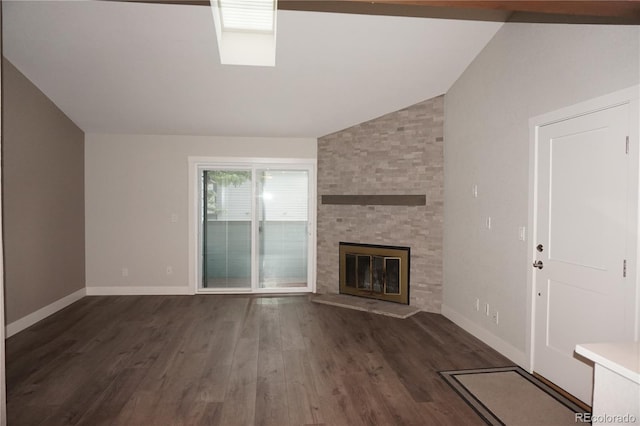 12033 E Harvard Ave Unit 208, Aurora, CO 80014 - unfurnished living room featuring vaulted ceiling, dark wood-type flooring, and a fireplace