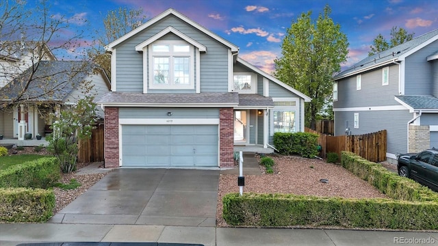 4279 Brandon Ave, Broomfield, CO 80020 - traditional home with brick siding, a garage, and fence