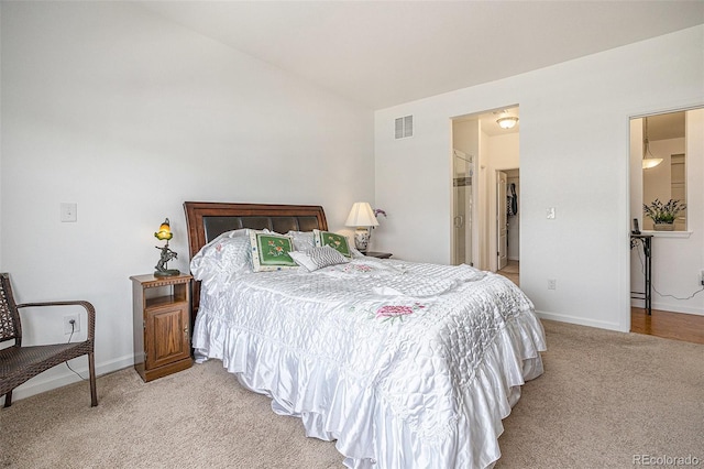 11791 Barrentine Loop, Parker, CO 80138 - bedroom with light colored carpet, lofted ceiling, and baseboards