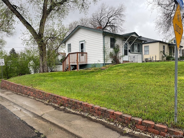 5899 Vance St, Arvada, CO 80003 - view of front of property with a front yard