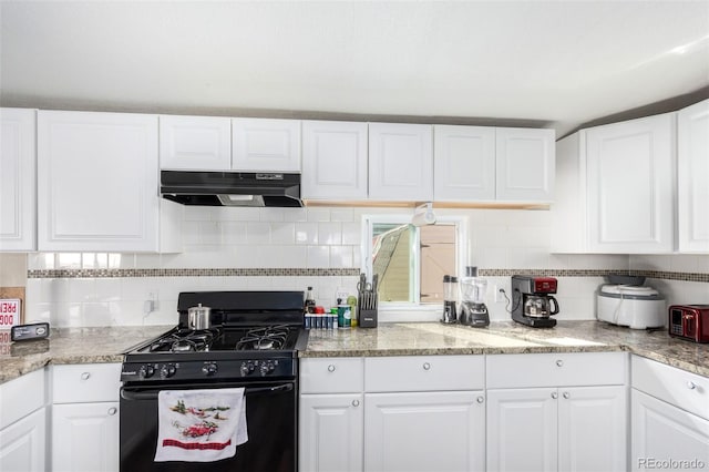 kitchen with white cabinets, tasteful backsplash, black gas range oven, and under cabinet range hood