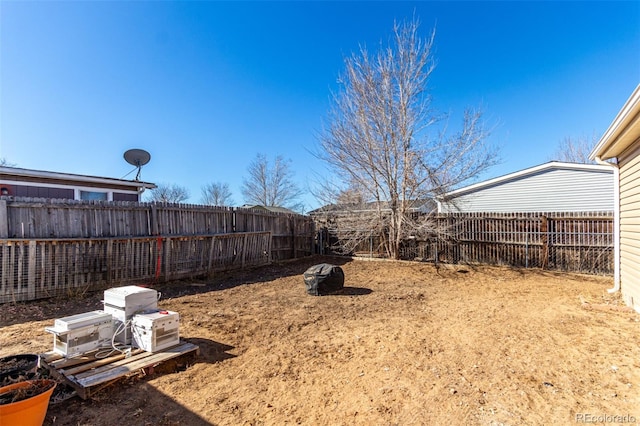 view of yard featuring a fenced backyard