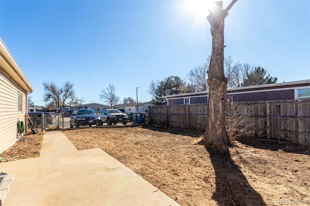 view of yard featuring a patio area and fence