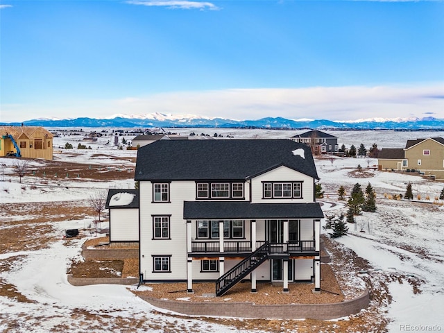 exterior space featuring a deck with mountain view