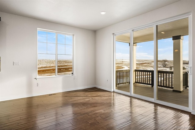 spare room featuring hardwood / wood-style flooring