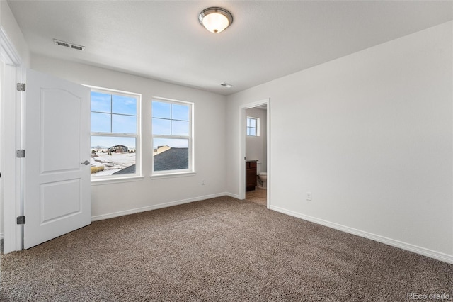 unfurnished room with carpet floors