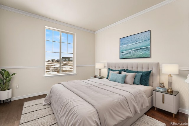 bedroom with crown molding and dark hardwood / wood-style flooring