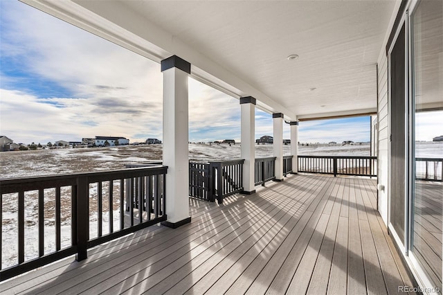 view of snow covered deck