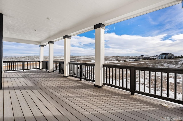 view of snow covered deck