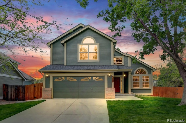 6735 W 97th Cir, Westminster, CO 80021 - traditional-style home with driveway, brick siding, and a garage