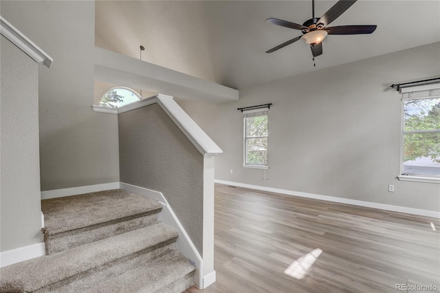 6735 W 97th Cir, Westminster, CO 80021 - staircase featuring healthy amount of natural light, a ceiling fan, baseboards, and vaulted ceiling